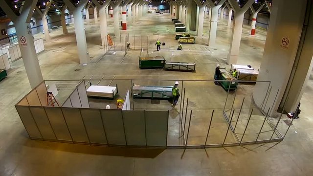 2020 - good time lapse of an emergency hospital constructed at McCormick Convention Center in Chicago during coronavirus Covid-19 emergency outbreak epidemic.