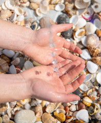 Male hands under a stream of water .