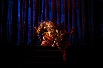 Ghost girls, spirits of the theater, before the scenes on the stage of the theater.