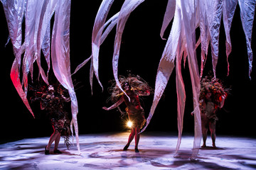 Ghost girls, spirits of the theater, standing on its stage
