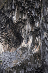 Structures of basalt lava cliffs in Gole dell’Alcantara gorge close to Taormina, Sicily Italy.