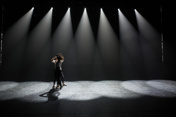 Beautiful couple of professional artists dancing  salsa
