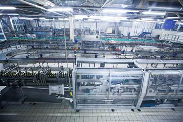 automatic industrial conveyor beverage line. Indoor view of Beer factory.