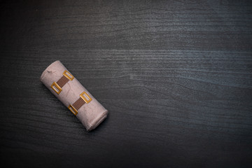 bandage on dark wooden table