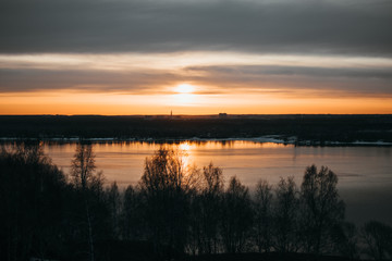 Naklejka premium View of the sunrise and the river from a high-rise building.