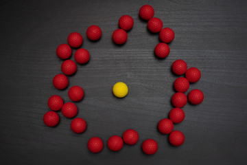 yellow ball repelling red balls