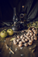 vintage wood table with a glass of nuts