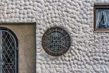 Ornamental window on the street of Hallstatt village in Austria in winter
