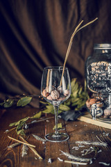 vintage wood table with a glass of nuts