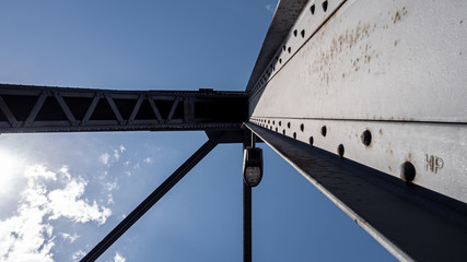 Iron construction of the bridge against the blue sky 2
