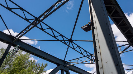 Iron construction of the bridge against the blue sky 1
