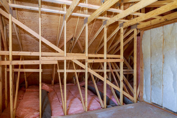 Insulation in the sloping attic of a new frame house