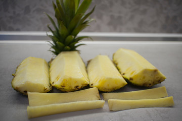 sliced fresh pineapple on the kitchen table
