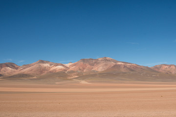 Fototapeta na wymiar Panorama of Andean mountain ridge and desert in Bolivia on Ruta de Las Lagunas
