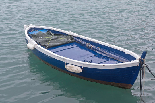 Blue Boat at Sea