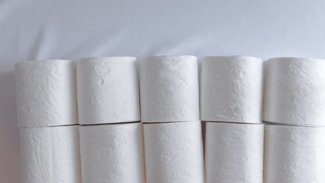 white toilet paper rolls time lapse animation pattern for texture with plain background