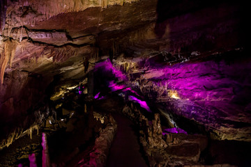 cave with rock growths with illumination