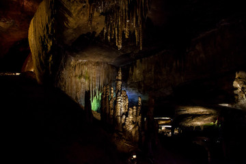 Fototapeta na wymiar cave with rock growths with illumination