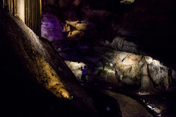 cave with rock growths with illumination
