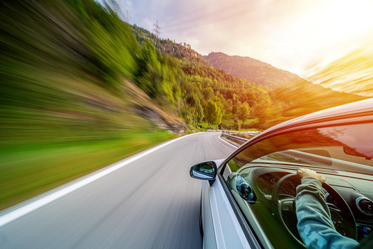 Car in motion blur driving in the Italian mountains