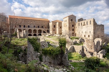 Ruins in front of Palace of Despots in Archeological site of Mystra near the Mystras city, Greece during sunset