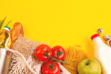 Food packaging on yellow background. Quarantine food delivery home. Flatlay banner with copyspace.