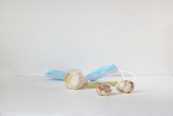 Antiviral home remedy garlic. The preservation of health during a pandemic.Medical mask