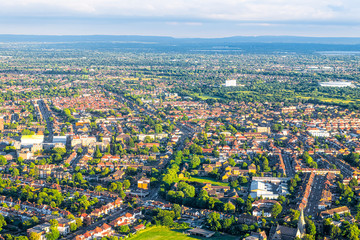 Aerial high angle above view from airplane over city suburbs of London in United Kingdom with...
