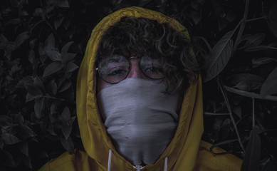 
dark man, with dark leaves and yellow hood
