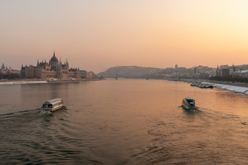 Naklejka premium The river Danube on a cold winter day with the Hungarian Parliament building in the background
