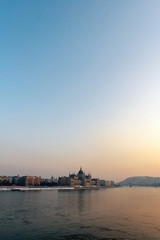 Obraz premium The river Danube on a cold winter day with the Hungarian Parliament building in the background