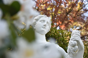 statue of a woman in a garden