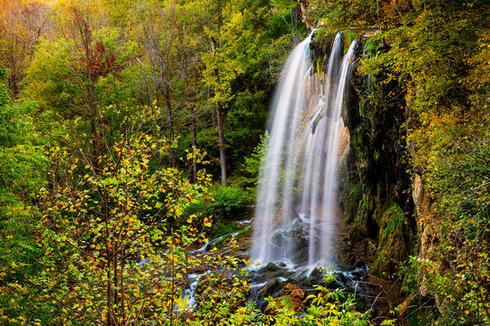 Appalachian Mountains Long Exposure Of Falling Spring Waterfall And Green Yellow Forest Trees In Rural Countryside Autumn In Covington, Virginia