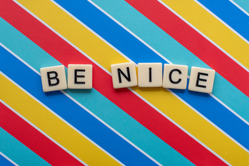 Be Nice Letter Tiles on colorful background