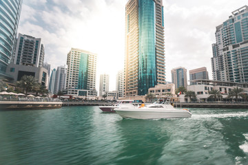 Naklejka premium Marina with yacht and skyscrapers Dubai - UAE