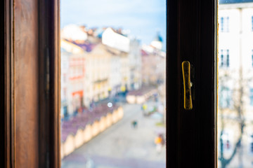Lviv, Ukraine abstract blurry view of historic Ukrainian city in old town rynok square in winter on sunny day sunset and Christmas market