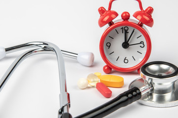 A picture of stethoscope, medicines and clock. It is for medical reminder.