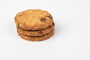 Delicious Oat cookies raisins with wholegrain on a white background.