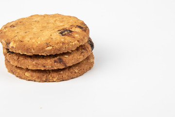 Delicious Oat cookies raisins with wholegrain on a white background.