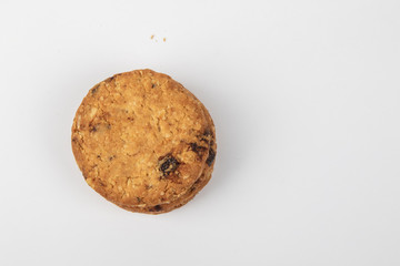 Delicious Oat cookies raisins with wholegrain on a white background.