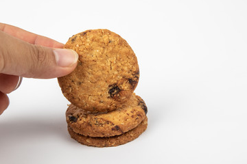 Delicious Oat cookies raisins with wholegrain on a white background.