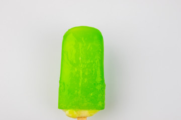 Man hand holding Ice Cream Popsicle Lime taste on White Background.