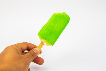 Man hand holding Ice Cream Popsicle Lime taste on White Background.