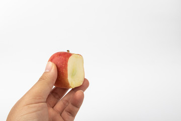 Man hand with a bite of Fresh apple isolate on white background.