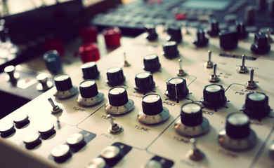 Synthesizers drum machine and other hardware equipment at recording studio  