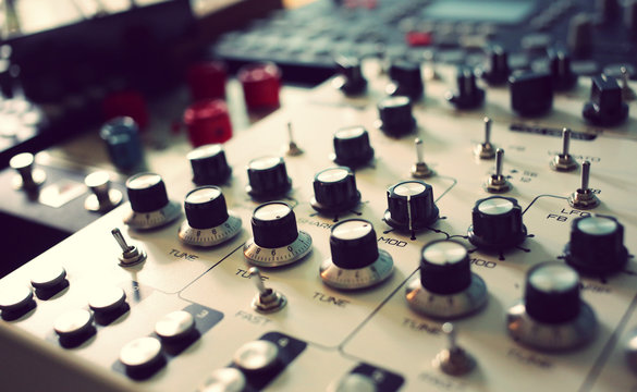 Synthesizers drum machine and other hardware equipment at recording studio  
