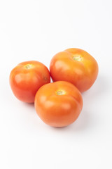 Fresh raw tomato isolated on white background.