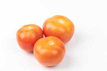 Fresh raw tomato isolated on white background.