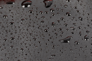 Water bubble and water drops on mirror surface selective focus. Water drop for background use.