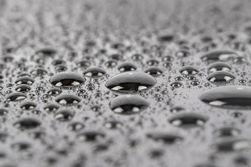 Water bubble and water drops on mirror surface selective focus. Water drop for background use.